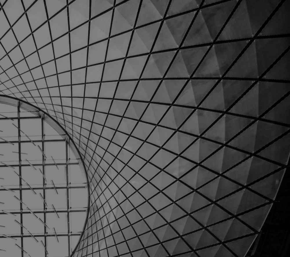 Looking up into a lattice dome of steel and glass